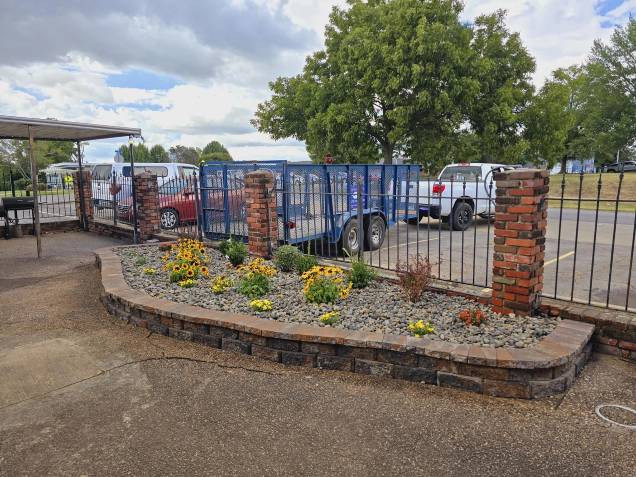 Commercial gated entrance with flower bed